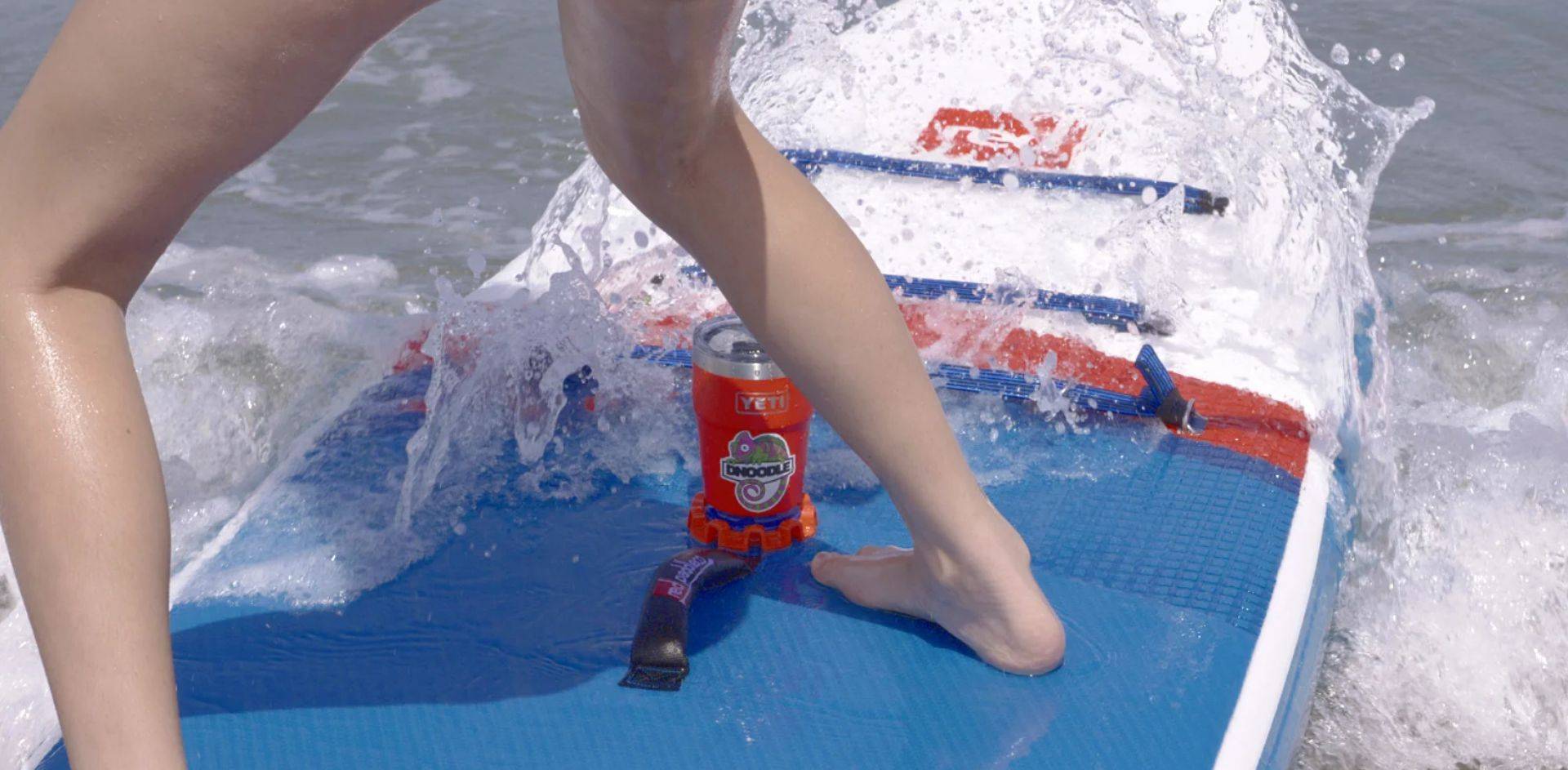 Dnoodle on SUP in Wave With Insulated Cup