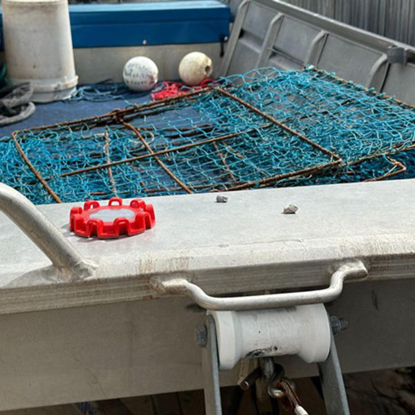 Dnoodle Dock Plate mounted on a fishing punt.
