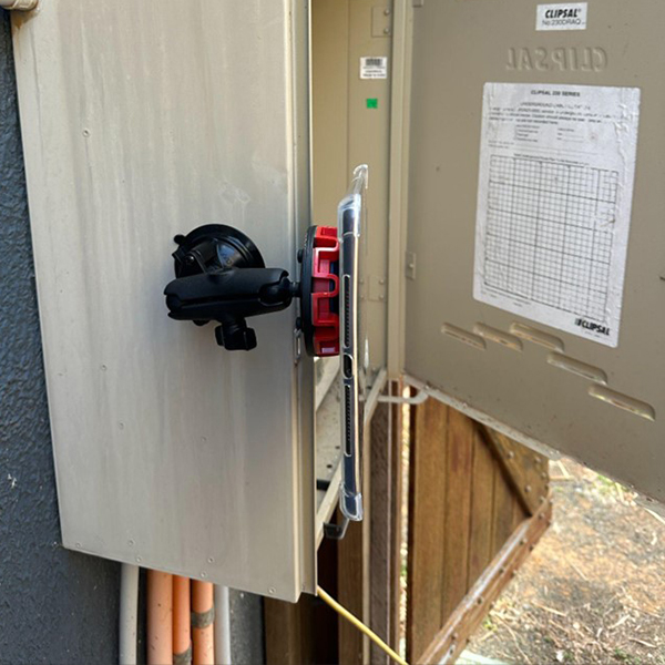 Dnoodle system with a suction cup and RAM arm holding an iPad on an electrical box.